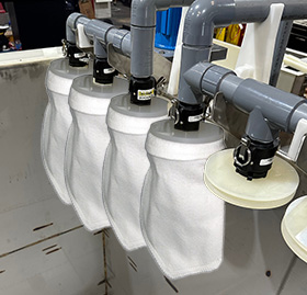 Palm Technology Bag filter unit designed for electroless nickel bath filtration and extended solution life