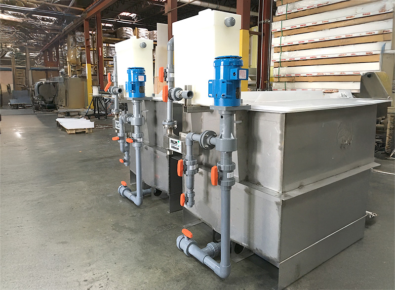 Fully assembled ENTank™ electroless nickel plating system including air spider, sealless vertical centrifugal pump, ENHeat™ heat exchanger, and filter bag holders.